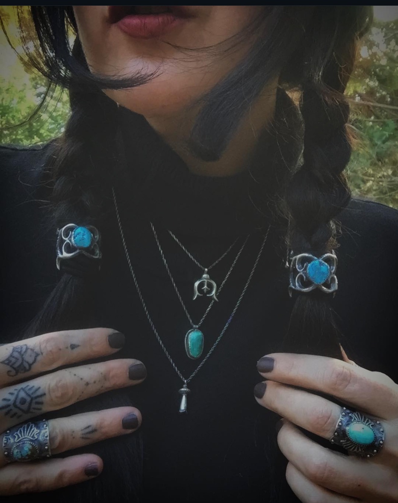 Jenna Knight with long braids, in her studio